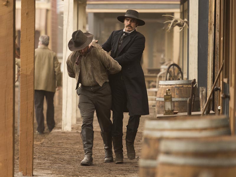 Jonathan C. Stewart as Wyatt Earp (right) - The American West _ Season 1, Episode 5 - Photo Credit: Michael Moriatis/AMC