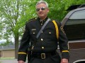 Talked About Scene Episode 208 Small Town Security: The Man Makes the Suit Dennis is proud to wear his new JJK uniform.
