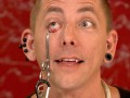 Extra Scene: Episode 210: Freakshow: Breaking World Records The Space Cowboy demonstrates a stunt in which he lifts weights suspended by hooks in his eye sockets.