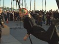 Extra Scene: Episode 212: Freakshow: Freaks Hanging by a Wire Kelvikta the Blade performs a stunt in which she is suspended by hooks attached to dermal piercings in her back.