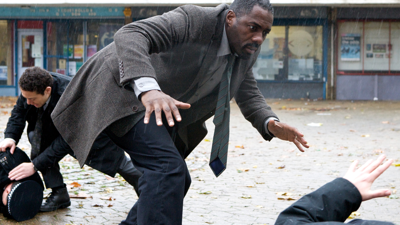 Luther takes cover from a sniper