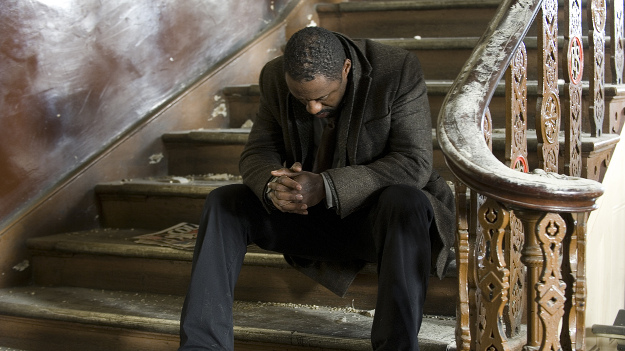 Luther waits for Mark North on the stairs