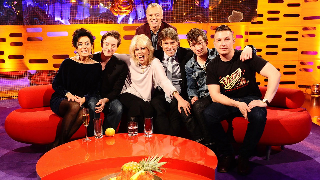 L-R: Graham strikes a pose with Nancy Dell'Olio, James McAvoy, Joanna Lumley, John Bishop and the Arctic Monkeys' Alex Turner and Jamie Cook.