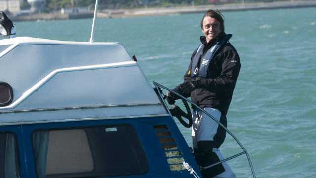 Richard steers his amphibious car