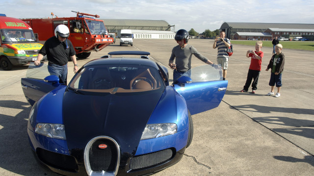 Richard gets in the two-toned Veyron.