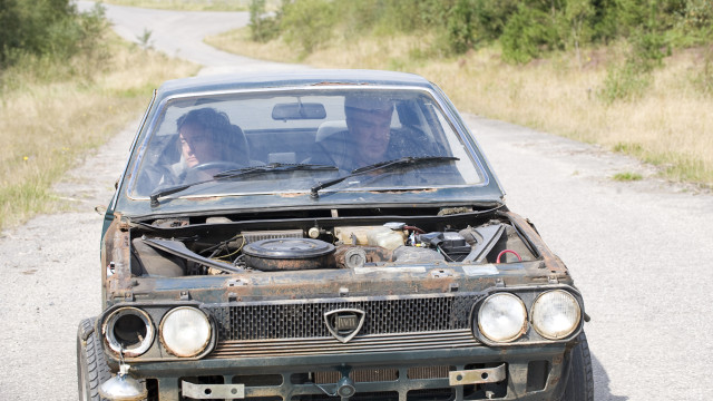 Jeremy and Richard sit in a broken down Lancia