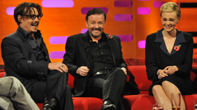 Trouble must be brewing: Johnny Depp, Ricky Gervais and Carey Mulligan snicker on set.