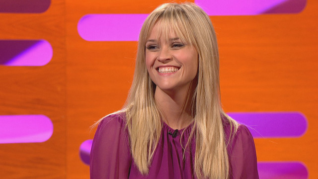 Reese Witherspoon laughs at Graham's inquiry about her bangs.