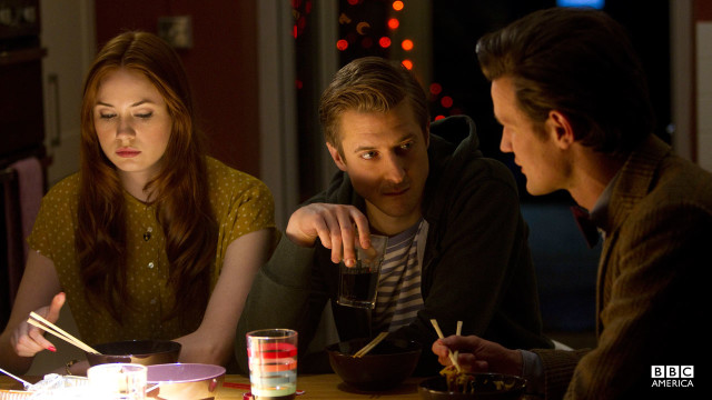 The Doctor, Amy, and Rory talk over a meal.