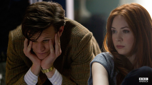 The Doctor sits frustrated.