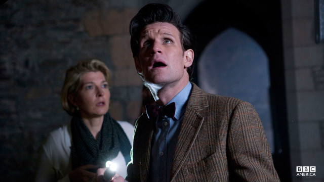 The Doctor looks up at something.