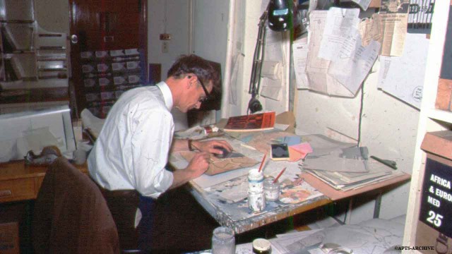 A graphic artist preparing visuals to illustrate a news story.