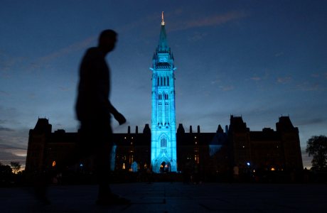 The Peace tower and Parliament buildings in Ottawa, Ontario are illuminated in royal blue to celebrate the birth of the royal baby on Monday July 22, 2013. (AP Photo/The Canadian Press, Adrian Wyld)