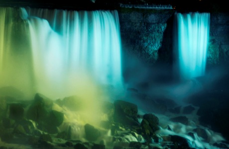 The American Falls and Bridal Falls are lit up blue in this view from Canada to celebrate the birth of the Duke and Duchess of Cambridge's son, Monday, July 22, 2013. (AP Photo/Gary Wiepert)