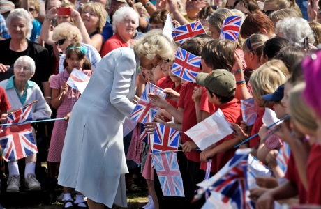 Camilla, Duchess of Cornwall is greeted by school children as she arrived in Cornwall yesterday, July 15. The Duchess and Prince Charles visit Cornwall and Devon each summer. (Photo via AP)