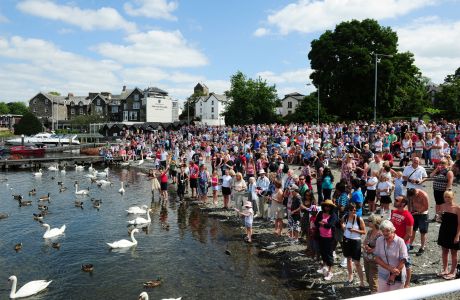 Crowds gather at the pier for the arrival of Queen Elizabeth II on Windermere pier. (Press Association via AP Images)
