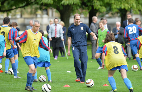 Prince William hosts a soccer match in his Grandmum's "backyard" ... at Buckingham Palace. (AP)