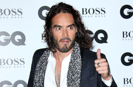 Russell Brand arrives at GQ Men of the Year Awards in London. (Photo by Joel Ryan/Invision/AP Images)