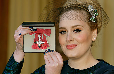 Adele gets her MBE (AP Images)