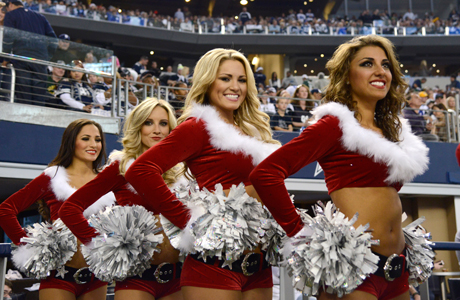Dallas Cowboys cheerleaders bringing excitement—and a holiday touch—to the game of American football. (Photo: Tim Sharp/AP)