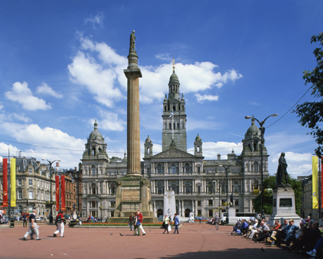 Glasgow Town Hall and monument, George Square, Glasgow, Scotland. (Photo by: Travel Pix/Robert Harding /AP Images)