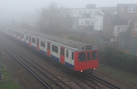 Spring weather March 13th. A District line underground train makes its way on the line between Richmond and Kew Gardens where visibility at times is less than 50 metres. A number of flights across the UK have been cancelled because of early morning fog. Picture date: Thursday March 13, 2014. See PA story TRANSPORT Fog. Photo credit should read: Martin Keene/PA Wire URN:19281790