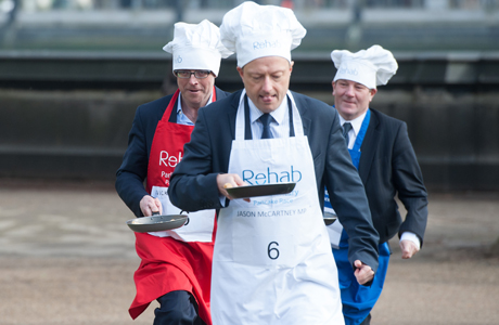Journalist Nick Robinson (L), Jason McCartney MP (C) and Lord Mawson (R) Rehab Parliamentary Pancake Race in Victoria Tower Gardens, Westminster, London, Britain - 04 Mar 2014 The charity race is organised as a competition between journalists, MPs and members of the House of Lords and proceeds are given to the charity 'Rehab'. (Rex Features via AP Images)