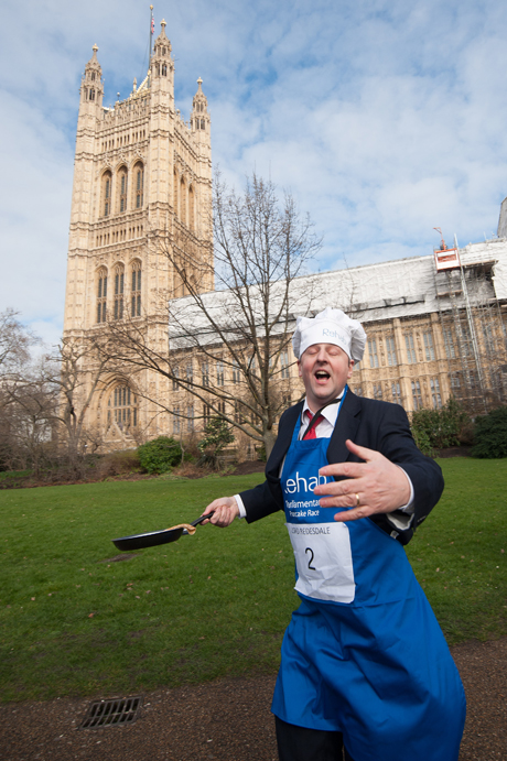 Lord Redesdale Rehab Parliamentary Pancake Race in Victoria Tower Gardens, Westminster, London, Britain - 04 Mar 2014 The charity race is organised as a competition between journalists, MPs and members of the House of Lords and proceeds are given to the charity 'Rehab'. (Rex Features via AP Images)