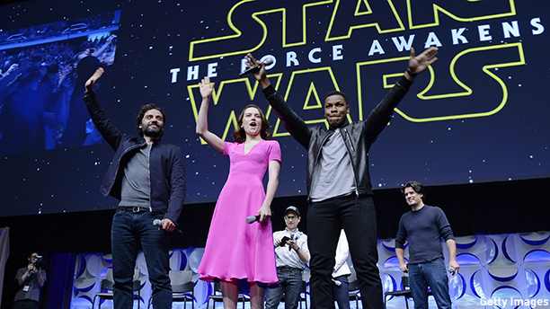 ANAHEIM, CA - APRIL 16: Cast members (L -R) Oscar Isaac, Daisy Ridley, John Boyega of "Star Wars: The Force Awakens" and back row (L-R) writer, director and producer J.J. Abrams, producer Kathleen Kennedy and host Anthony Breznican, Entertainment Weekly reporter, acknowledge fans at the kick-off event during Disney's Star Wars Celebration 2015 at the Anaheim Convention Center April 16, 2015. The Star Wars Celebration runs through April 19. (Photo by Kevork Djansezian/Getty Images)