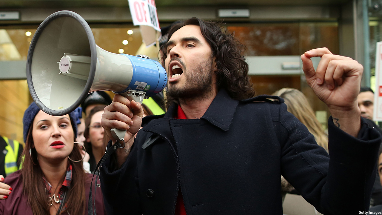 Russell Brand protests pending eviction with residents and supporters from the New Era housing estate in East London in 2014. (Dan Kitwood/Getty Images)