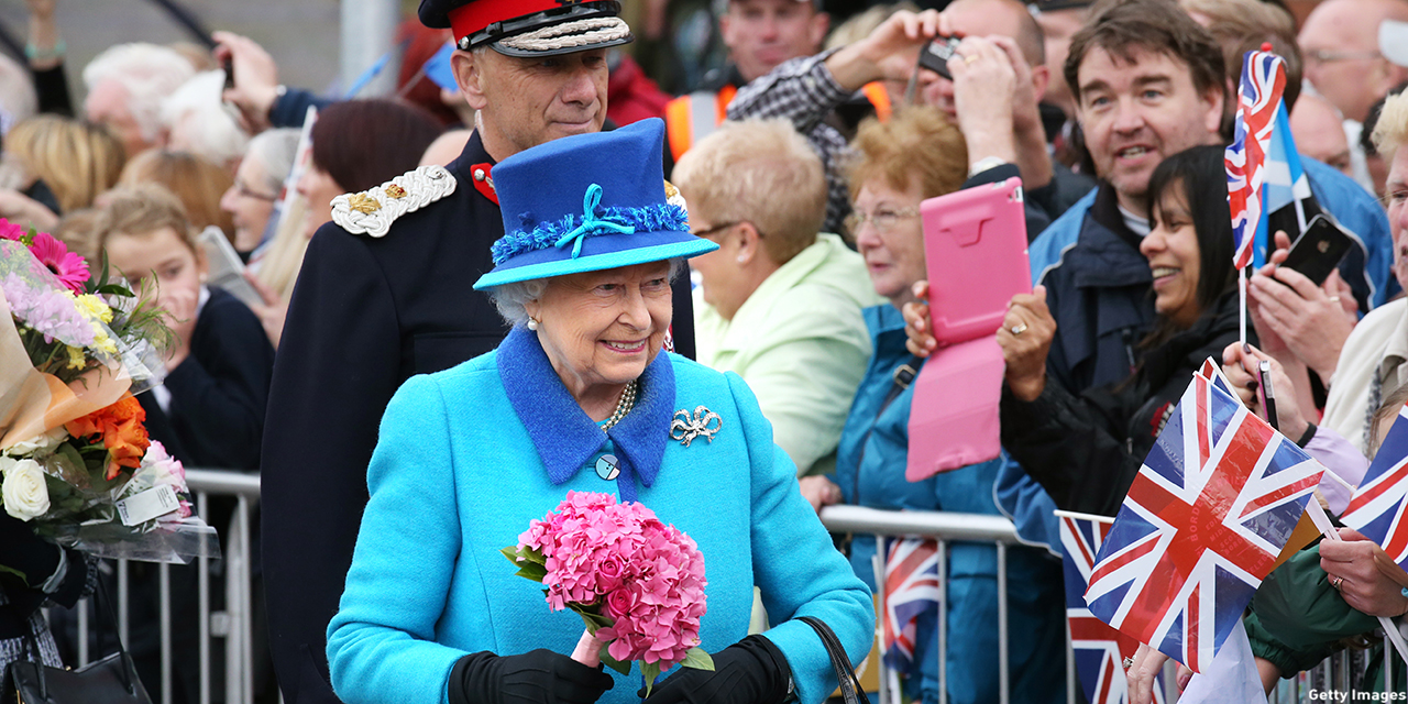 Queen Elizabeth II arrives to greets well-wishers before she unveils a commemorative plaque at Newtongrange railway station on board the steam locomotive 'Union of South Africa' on the day she becomes Britain's longest reigning monarch on September 09, 2015 in Newtongrange, Scotland. Today, Her Majesty Queen Elizabeth II becomes the longest reigning monarch in British history overtaking her great-great grandmother Queen Victoria's record by one day. The Queen has reigned for a total of 63 years and 217 days. Accompanied by her husband and Scotland's First Minister Nicola Sturgeon she will officially open the new Scottish Border's Railway which runs from the capital to Tweedbank. (Photo: Andrew Milligan - WPA Pool/Getty Images)