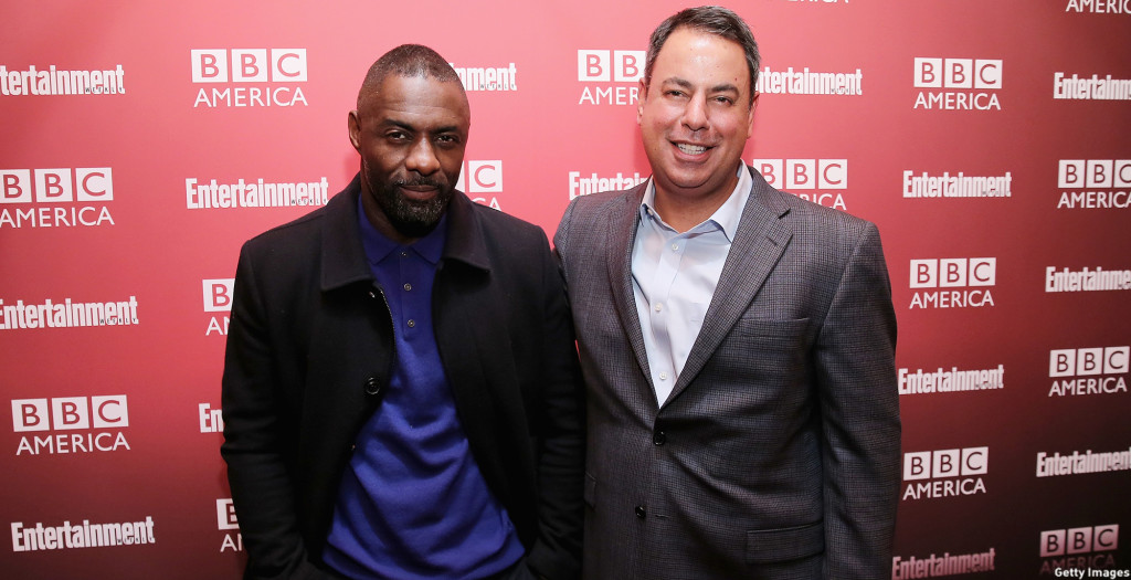 Elba embraced his longtime friend, BBC America’s SVP of Programming Richard De Croce on the red carpet. (Neilson Barnard/Getty Images)