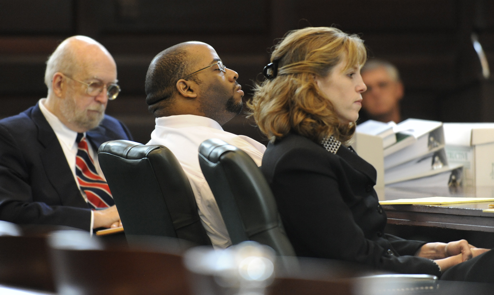 Still for the documentary "Scenes of a Crime"; Murder defendant Adrian Thomas(c) listens to the opening statements flanked by his defense attorneys Jerome Frost(l) and Ingrid Effman(r) in Rensselaer County Courthouse in Troy, New York October 2, 2009.