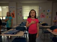 An elementary school class recite the pledge of allegiance, from The Whitest Kids U'Know season 5, episode 7.