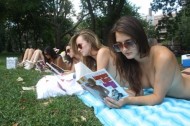 Topless sunbathers read pulp fiction, fight for equality