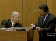 The defense talks to a witness about the supposed murder weapon.