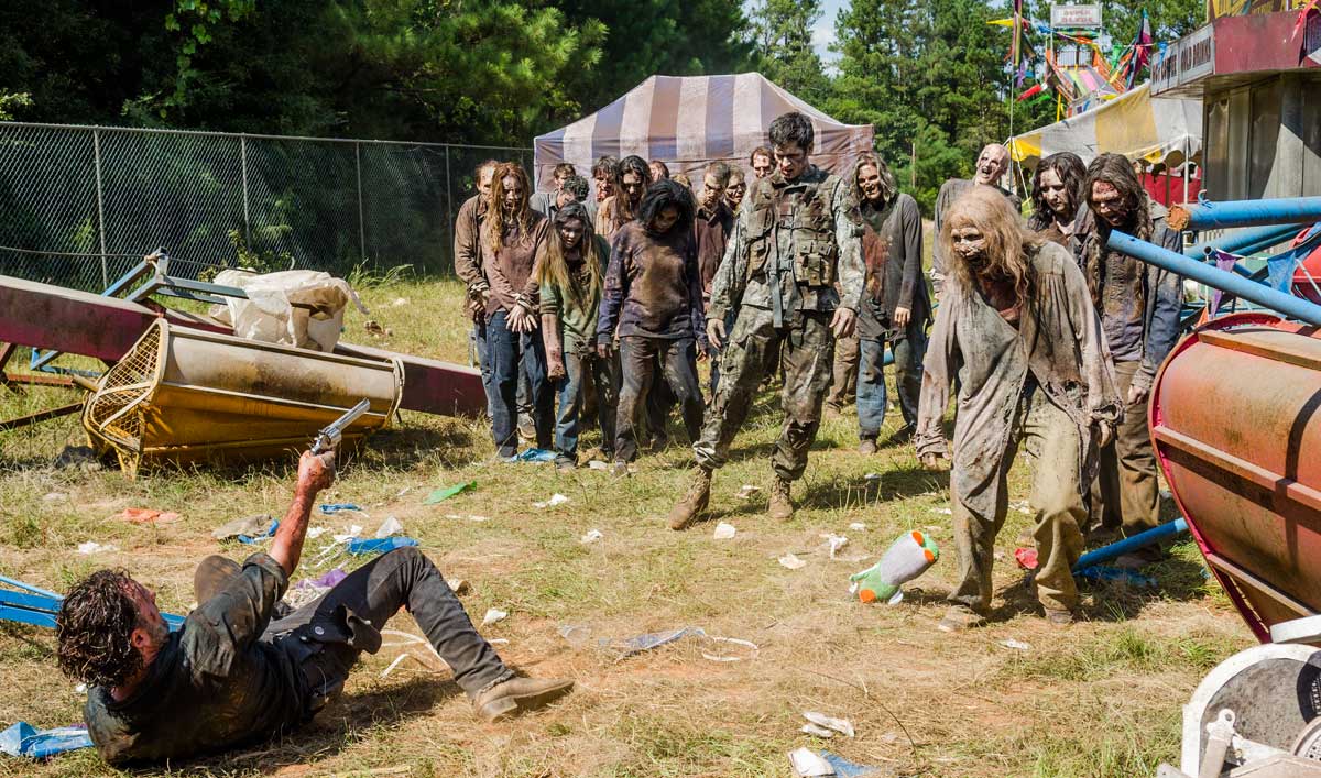 Rick Falls Into a Horde of Walkers in a Talked About Scene From <em>The Walking Dead</em> Season 7, Episode 12