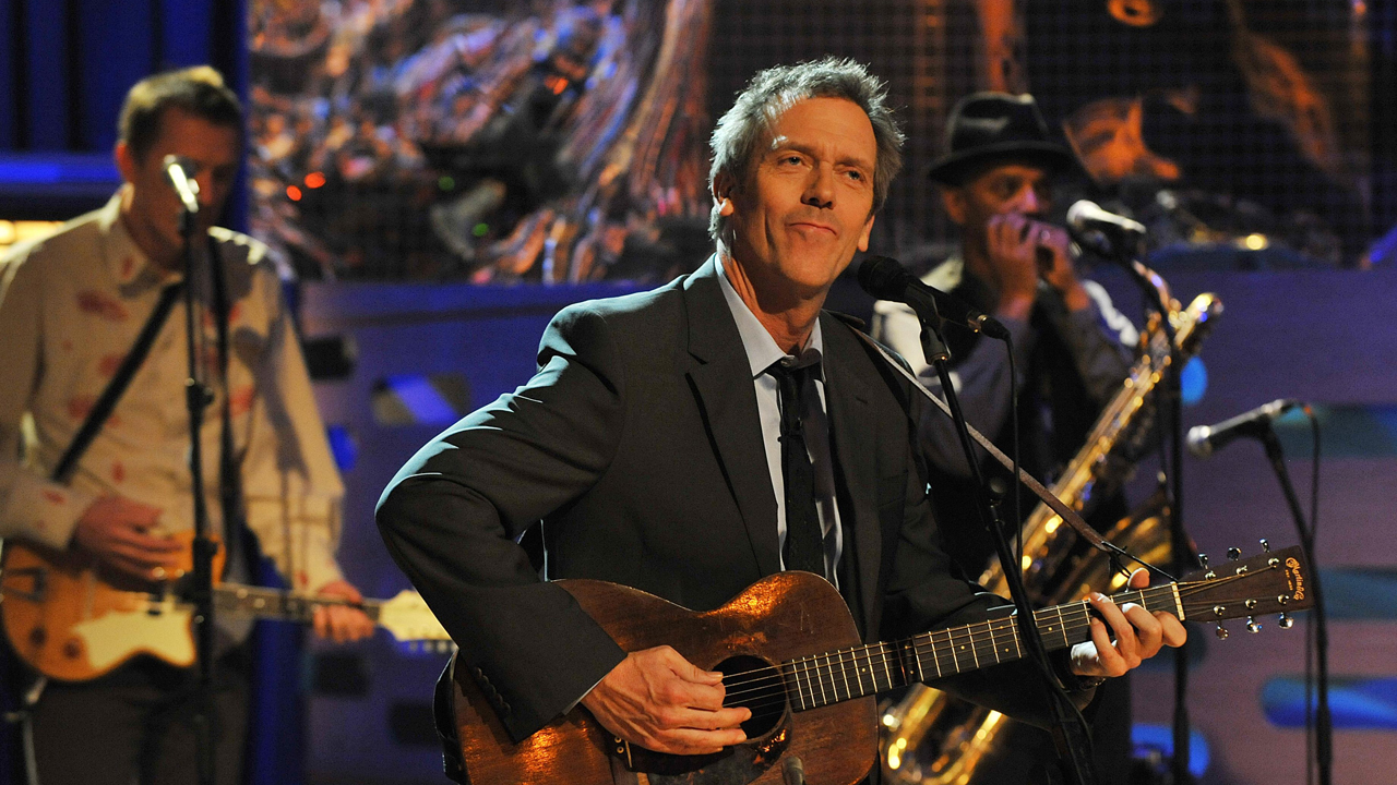 Hugh Laurie performs with his band during episode 2.