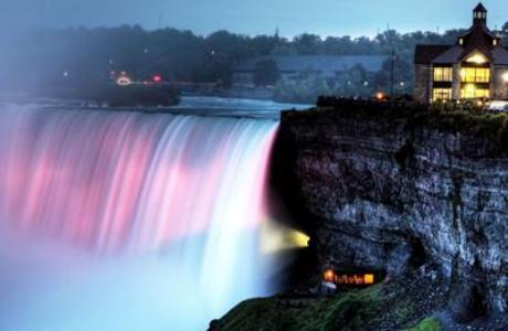 Niagara Falls cast in blue and pink lights. (Photo via the Niagara Falls Facebook Page)
