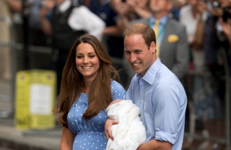 Britain's Prince William, right, and Kate, Duchess of Cambridge hold the Prince of Cambridge, Tuesday July 23, 2013, as they pose for photographers outside St. Mary's Hospital exclusive Lindo Wing in London where the Duchess gave birth on Monday July 22. The Royal couple are expected to head to London’s Kensington Palace from the hospital with their newly born son, the third in line to the British throne. (AP Photo/Matt Dunham)