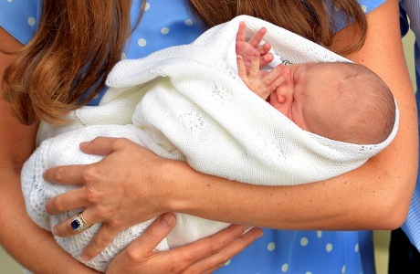 Kate, the Duchess of Cambridge, carries her new born son, the Prince of Cambridge, who was born on Monday. into public view for the first time. outside the Lindo Wing of St. Mary's Hospital, in London, Tuesday, July 23, 2013. The boy will be third in line to the British throne. (AP Photo/John Stillwell, Pool)