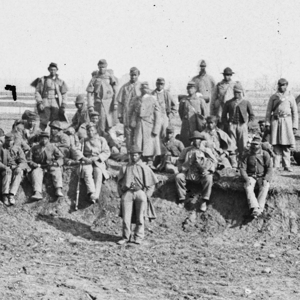 African-American soldiers rest on a hill, 1864. (via http://www.loc.gov/pictures/resource/cwpb.02032/)