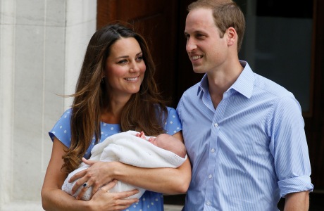 Britain's Prince William, right, and Kate, Duchess of Cambridge hold the Prince of Cambridge, Tuesday July 23, 2013, as they pose for photographers outside St. Mary's Hospital exclusive Lindo Wing in London where the Duchess gave birth on Monday July 22. The boy, who is third in line to the British throne, has since been named George Alexander Louis by his parents and will be known as Prince George of Cambridge. (AP Photo/Kirsty Wigglesworth)