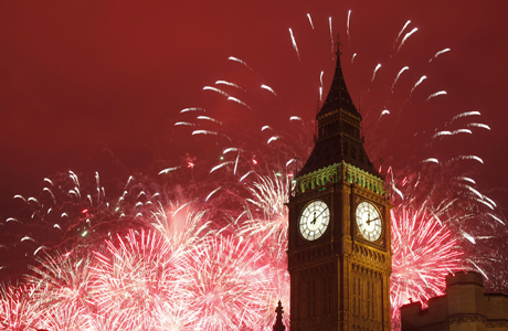 Fireworks explode over the Houses of Parliament, including St Stephen's Tower which holds the bell known as Big Ben as London celebrates the arrival of New Years Day Sunday, Jan. 1, 2012. (AP Photo/Alastair Grant)