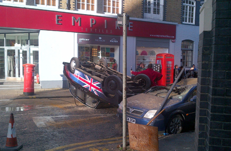 Black cab with union jack on the side? Check. Quintessential red phone booth? Check. We are in London. (Rex Features/AP)