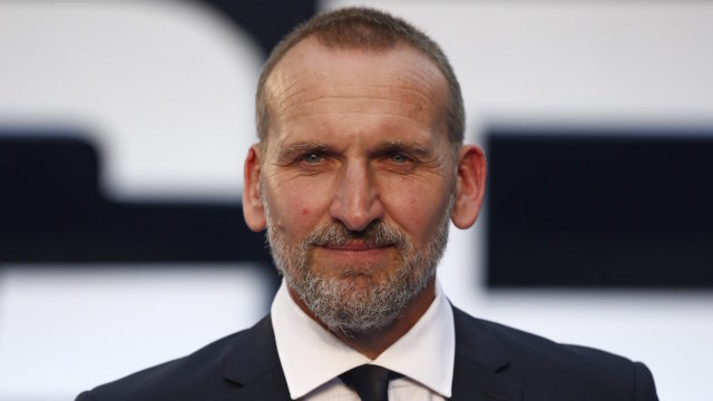 British actor Christopher Ecclestone poses for pictures on the red carpet after arriving to attend the world premier of “Legend” in central London on September 3, 2015.