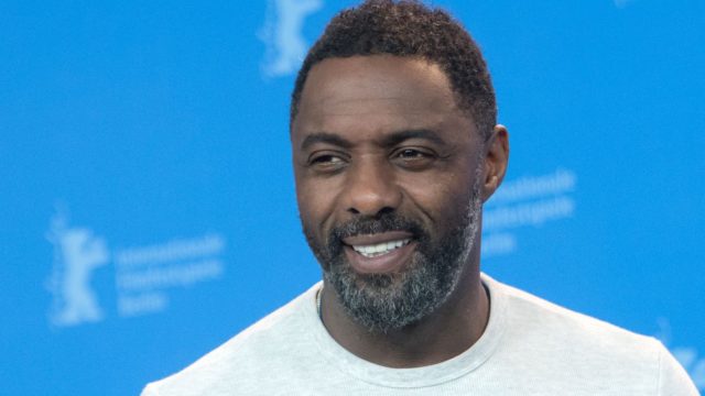 British actor, director and executive producer Idris Elba poses during a photo call for the film “Yardie” shown in the “Panorama Special” category during the 68th edition of the Berlinale film festival in Berlin on February 22, 2018. / AFP PHOTO / Stefanie LOOS