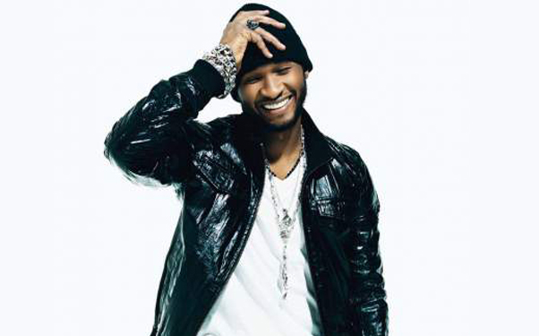 Usher Gets Kicked In Head While Wooing A Woman On Stage (photo)